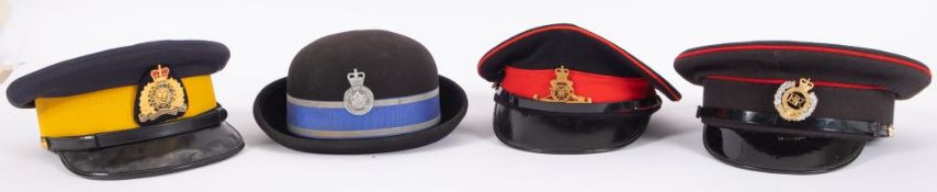 A Royal Engineers peaked cap, together with a Royal Artillery peaked cap,