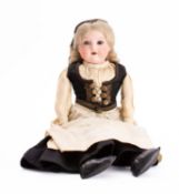An Armand Marseille bisque head doll in Icelandic 'Faldbuningur' costume, applied blonde wig,