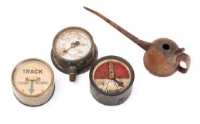 A circular brass signal indicator, together with a black lacquer cased signal indicator,