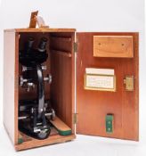 A 20th century Binocular Microscope by Cooke Troughton and Simms in case.
