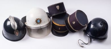 Three French Police Kepis, together with a French Police steel helmet,