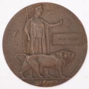 A WWI Death Plaque for John Jones, 12cm diameter.