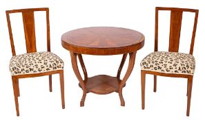 A mahogany occasional table and twin chairs en suite, in Art Deco style,