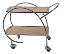 A chromium plated metal and melamine veneered 'rocket' tea trolley,