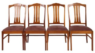A teak and beechwood extending dining table and four chairs, probably by Parker Knoll,