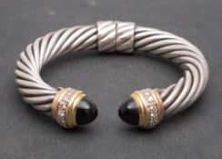 David Yurman, a hinged cuff bangle, of twisted cable design,