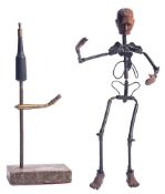 An articulated metal and carved wood mounted model of a man, in the manner of a lay figure,