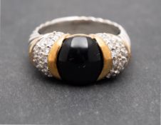 David Yurman, a cabochon-cut onyx ring, the shoulders set with round, brilliant-cut diamonds,