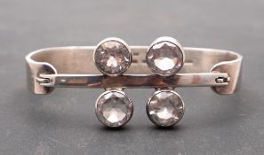 Valon Kulta & Hopea, a round, mixed-cut rock crystal and silver bangle,