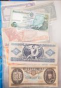 An album of world banknotes.