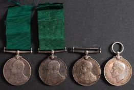 Four Royal Naval Reserve Long Service and Good Conduct Medals.