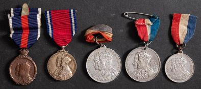 An Edward VII Coronation Medal 1902 in case of issue, together with a Jubilee Medal 1935,
