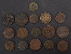 Approximately sixteen 17th Century farthings and half penny tokens.