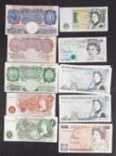 A collection of English banknotes.