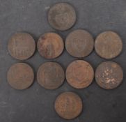 Ten copper 18th Century trade tokens.
