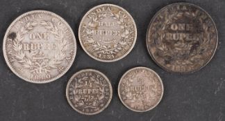 An East India Company 1840 rupee, 1835 rupee, 1835 half rupee, two 1840 1/4 rupees.