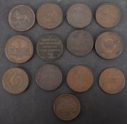 Thirteen 19th Century copper penny trade tokens, including Anglesey and Camarthen.