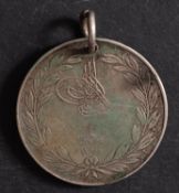 A Turkish Crimea Medal (Sardinia issue).