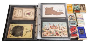 A small album of humorous postcards, together with a collection of empty Players Cigarette packets.
