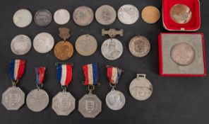 A bag of medallions and coins some boxed silver attendance medals.