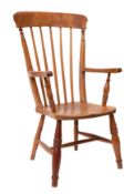 An ash, beech and oak spindle back elbow chair,