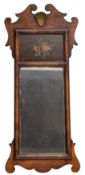 A walnut fret cut and decorated mirror in the early 18th Century taste with gilt scallop shell