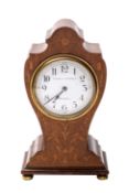 A Edwardian mahogany balloon clock the French eight-day duration movement having a platform lever