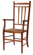 A stained hardwood and rush seated open elbow chair,
