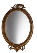 A Victorian gilt composition framed oval wall mirror, circa 1870,