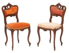 A pair of Victorian carved walnut and upholstered side chairs in Rococo Revival style,