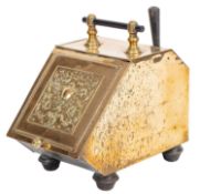 A 19th century brass embossed coal box; the hinged fall decorated with a Neoclassical urn,