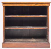An early 19th-century rosewood open bookcase; with a rectangular top and plinth base; 90cm high,