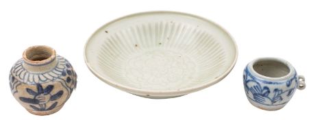 A small Chinese 'Hatcher Cargo' celadon dish and two small blue and white jarlets the dish incised