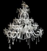 A contemporary cut glass three tier graduated twelve branch chandelier;