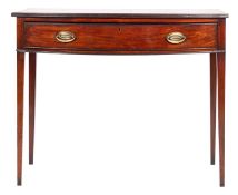 A George III mahogany bowfront side table, circa 1800; the bow top with reeded edge,