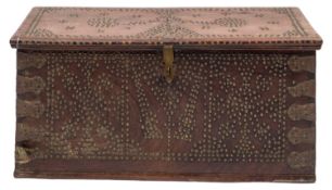 A 19th-century Zanzibar hardwood and brass studded trunk; with a hinged top enclosing a candle box,