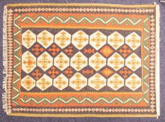 An Anatolian kelim, the chocolate brown field with three rows od ivory cruciform medallions,