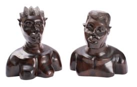 A pair of African carved ebony busts of a man and a woman,