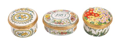 A group of three Halcyon Days enamel boxes including 'Happy Birthday' and '1983'