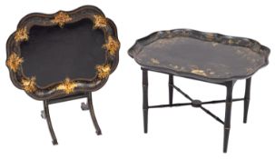 A Victorian papier mache and black lacquer tray of shaped outline,