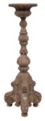A 19th-century Italianate carved limewood torchere; with a circular top,