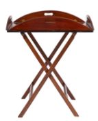 A mahogany butler's tray on stand in George III style, 19th century; with demi-lune fold down sides,