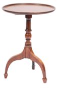 An early 19th century mahogany circular occasional table;
