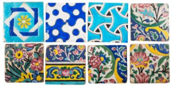 A group of eight Persian Qajar polychrome tiles decorated with geometric designs,