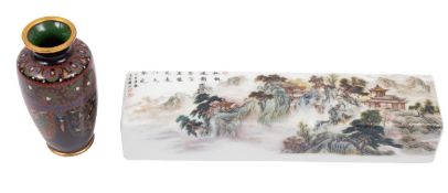 A Chinese porcelain scroll weight and a small Japanese cloisonne vase the weight decorated with