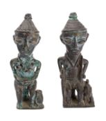 A pair of West African cast metal figures in the manner of Benin bronzes,