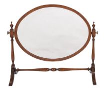A mahogany and crossbanded oval dressing table mirror, in George III style,