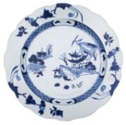 A Chinese blue and white 'Nanking Cargo' dish with scalloped rim,