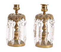 A pair of Regency gilt metal and glass hung lustre candlesticks,