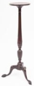 A carved mahogany torchere stand in the Hepplewhite style,